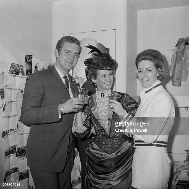 British actress Dinah Sheridan toasting his son, Conservative Party politician Jeremy Hanley and his wife Helene Mason, UK, 22nd September 1968.