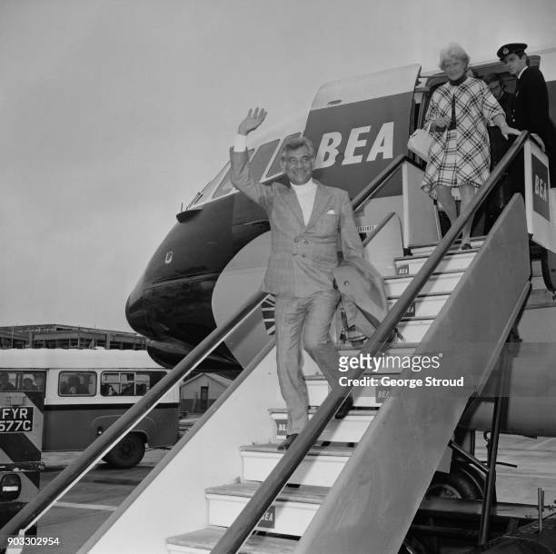 American composer, conductor and author Leonard Bernstein arrives at Heathrow Airport, London, UK, 27th September 1968.