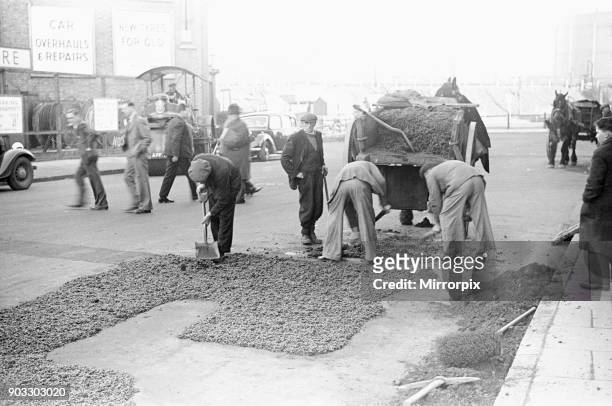 Council workmen seen here repairing a road in Kingston Upon Thames January 1939.