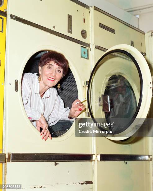 EastEnders star June Brown in a launderette. 6th February 1997.