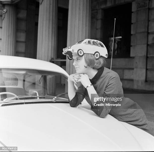 Miss Patricia McKenzie of Bagot Street, Liverpool, wears the car hat in aid of thalidomide children. Patricia McKenzie became Kim Woodburn, and a...