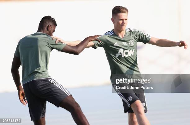 Axel Tuanzebe and Scott McTominay of Manchester United in action during a first team training session at Nad Al Sheba Sports Complex on January 10,...