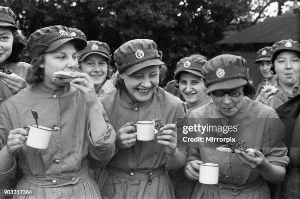 New W.A.T.S. Recruits at the Cowshot Manor Camp Brookwood, Surrey enjoying a mug of tea and a slice of bread and jam following an inspection by Sir...