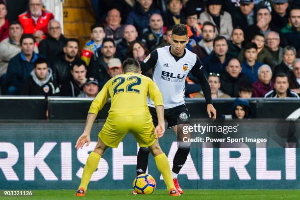 Andreas Pereira of Valencia CF fights for the ball with Antonio Rukavina of Villarreal CF during the La Liga 2017-18 match between Valencia CF and...