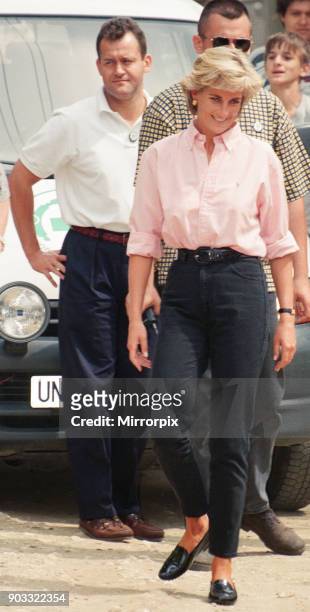 Paul Burrell (left, in the background in the white shirt and black trousers, butler to Diana, Princess of Wales as she makes a three day visit to...