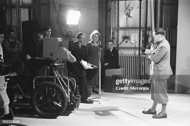 Picture Page television magazine programme seen here being broadcast from the BBC studios at Alexandra Palace. January 1939. Our picture Shows:...