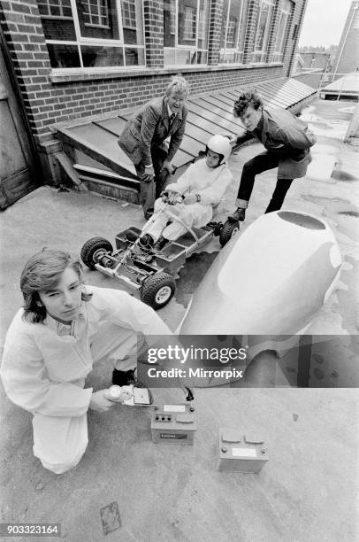 Picture shows students and lecturer at Garretts Green Technical College in Birmingham pictured with their electric electronic car. At work on the car...