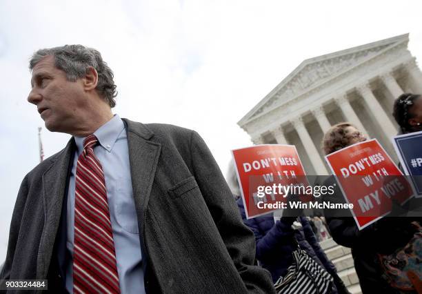 Sen. Sherrod Brown waits to speak during a rally held by the group Common Cause in front of the U.S. Supreme Court January 10, 2018 in Washington,...
