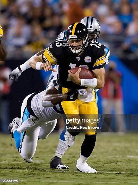 Charles Johnson of the Carolina Panthers runs down Mike Reilly of the Pittsburgh Steelers during their preseason game at Bank of America Stadium on...