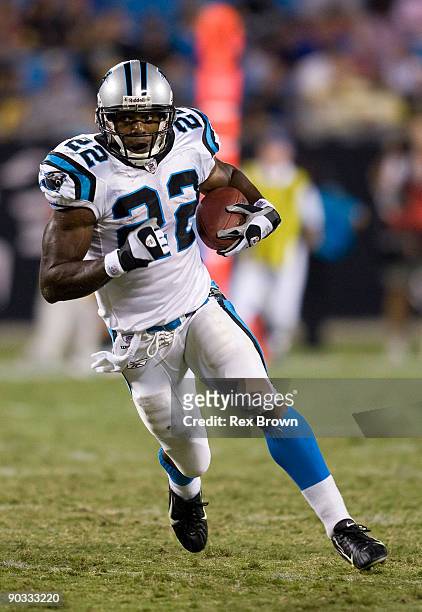 Jamall Lee of the Carolina Panthers carries for a first down against the Pittsburgh Steelers during their preseason game at Bank of America Stadium...