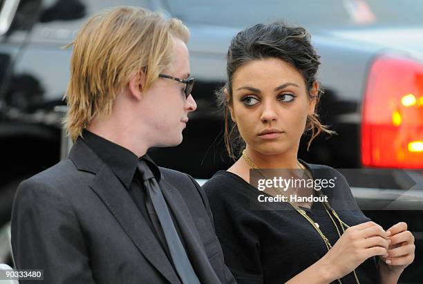 In this handout photo provided by Harrison Funk/The Jackson Family, Actor Macaulay Culkin and Actress Mila Kunis attend Michael Jackson's funeral...