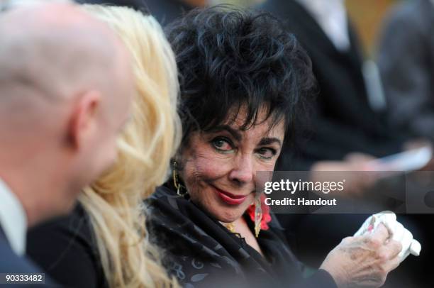 In this handout photo provided by Harrison Funk/The Jackson Family, Actress Elizabeth Taylor attends Michael Jackson's funeral service held at...