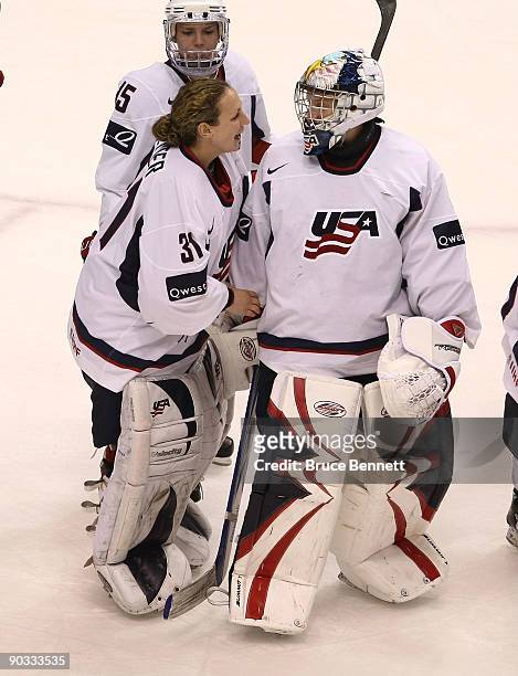 Jessie Vetter and Molly Schaus of Team USA celebrate their 4-2 victory over Team Canada during the Hockey Canada Cup at General Motors Place on...