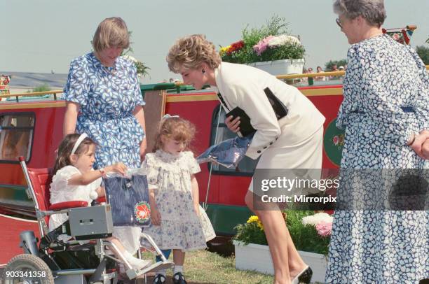 The Princess of Wales, Princess Diana, during her visit to Manchester, England. She exits the red barge in the background 'Prince William' at...