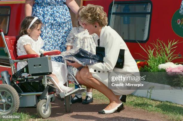 The Princess of Wales, Princess Diana, during her visit to Manchester, England. She exits the red barge in the background 'Prince William' at...