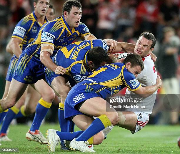 Dean Young of the Dragons is tackled during the round 26 NRL match between the St George Illawarra Dragons and the Parramatta Eels at WIN Jubilee...