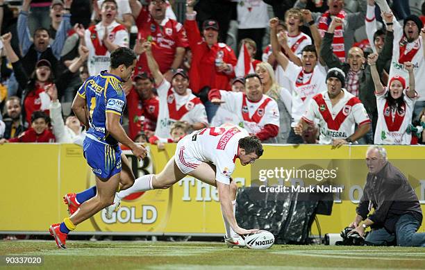 Brett Morris of the Dragons scores during the round 26 NRL match between the St George Illawarra Dragons and the Parramatta Eels at WIN Jubilee...