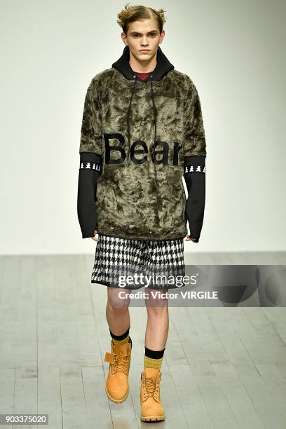 Model walks the runway at the Bobby Abley show during London Fashion Week Men's January 2018 at BFC Show Space on January 8, 2018 in London, England.