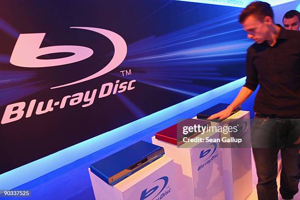 Visitor looks at the latest Blu-ray disc players at the Philips stand on opening day at the IFA technology trade fair on September 4, 2009 in Berlin,...