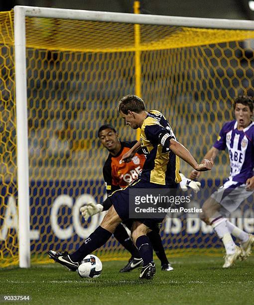 Alex Wilkinson of the Mariners kicks a goal during the round five A-League match between the Central Coast Mariners ans the Perth Glory at Canberra...