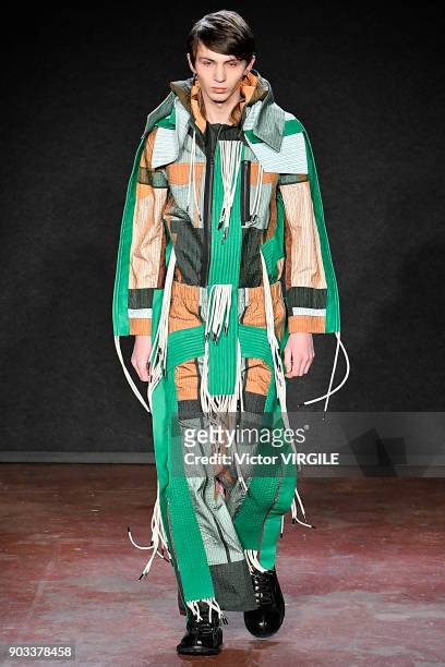 Model walks the runway at the Craig Green show during London Fashion Week Men's January 2018 at The Workshop on January 8, 2018 in London, England.