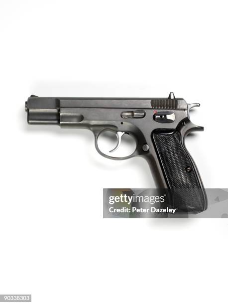 9mm hand gun on white background. - 9mm pistol stock-fotos und bilder