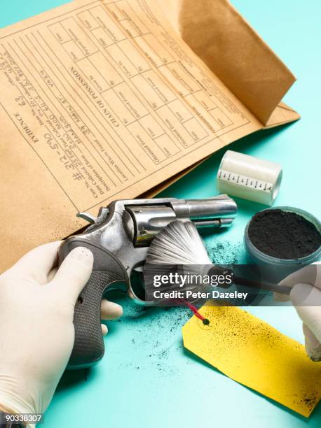 forensic scientist dusting for finger prints. - dusting stock pictures, royalty-free photos & images