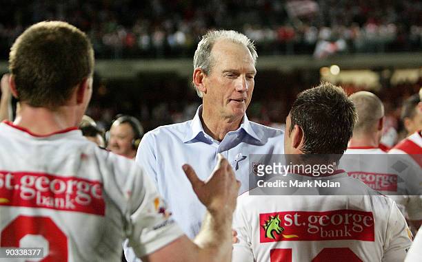 Dragons coach Wayne Bennett congratulates his players after the round 26 NRL match between the St George Illawarra Dragons and the Parramatta Eels at...