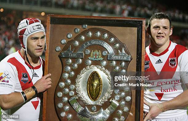 Jamie Soward and Brett Morris of the Dragons pose with the J J Giltinan Shield for winning the Minor Premiership trophy after the round 26 NRL match...