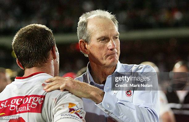 Dragons coach Wayne Bennett congratulates his players after the round 26 NRL match between the St George Illawarra Dragons and the Parramatta Eels at...