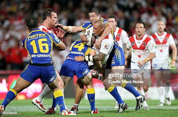 Jeremy Smith of the Dragons is atckled during the round 26 NRL match between the St George Illawarra Dragons and the Parramatta Eels at WIN Jubilee...