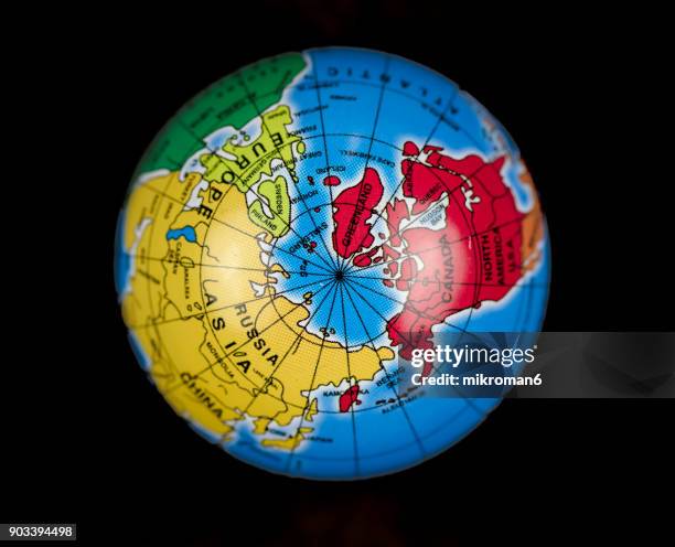close-up of globe against black background - usa russia stock pictures, royalty-free photos & images