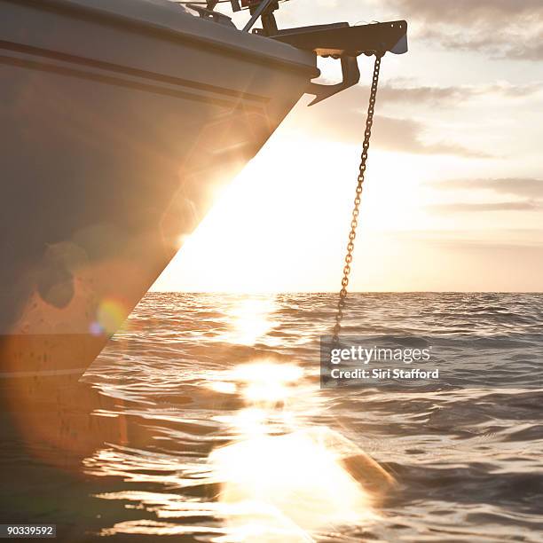 boat anchored at sunset - siri stafford fotografías e imágenes de stock