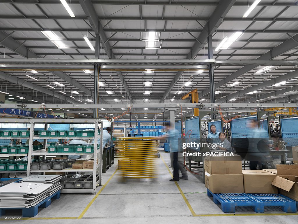 Workers on a high tech factory floor