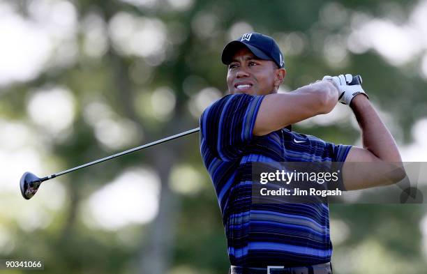 Tiger Woods hits a tee shot during the first round of the Deutsche Bank Championship held at TPC Boston on September 4, 2009 in Norton, Massachusetts.