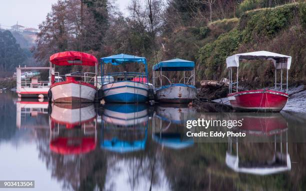 boats with reflections in the river - corunna stock pictures, royalty-free photos & images