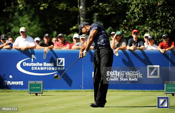 Tiger Woods hits from the 18th tee box during the first round of the Deutsche Bank Championship held at TPC Boston on September 4, 2009 in Norton,...