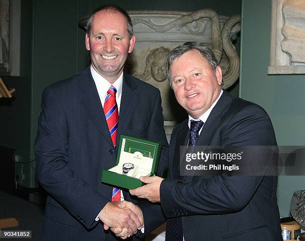 Ian Woosnam of Wales receives from Andy Stubbs, the Rolex Player of the Year Award at the Annual Awards Dinner held at Woburn Abbey prior to the...