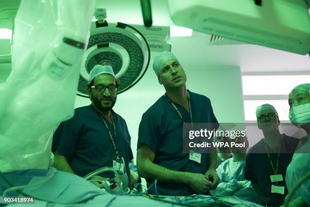 Prince William, Duke of Cambridge stands in the surgery theatre in front of a da Vinci XI machine prior to a highly complex robotic cancer operation...