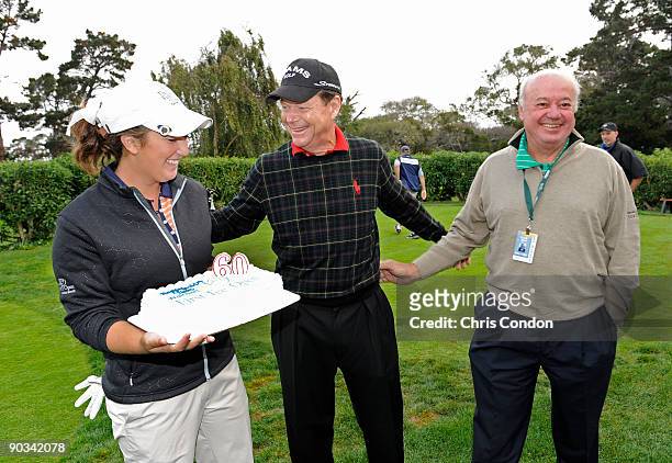 Tom Watson is presented with a birthday cake for his 60th birthday by his junior playing partner Gianna Misenhelter and tournament director Ollie...