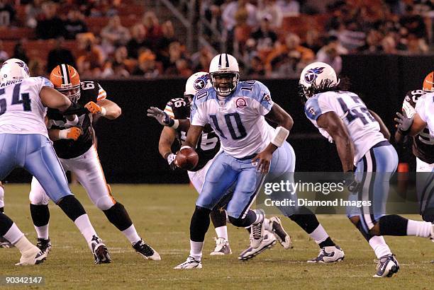 Quarterback Vince Young of the Tennessee Titans hands the ball to running back Chris Henry during a preseason game on August 29, 2009 against the...