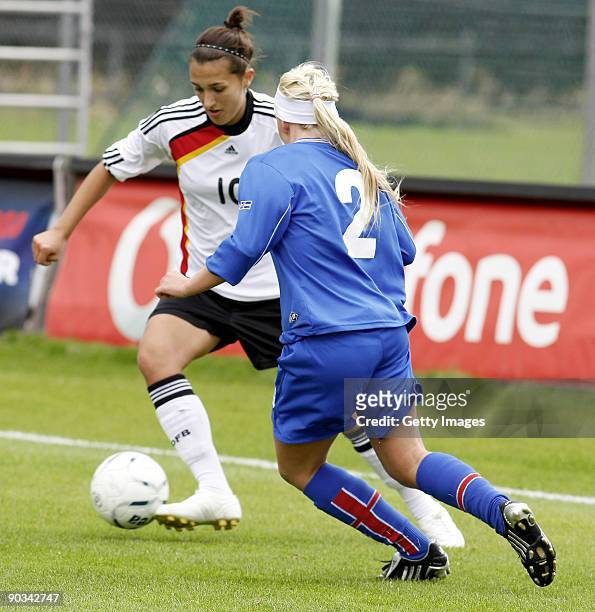 Hildur Sif Hauksdottir of Iceland and Kyra Malinowski of Germany fight for the ball during the Women's Euro qualifying match between U17 Iceland and...