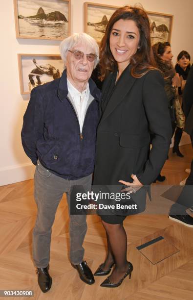 Bernie Ecclestone and Fabiana Flosi attend the private view of "JR: Giants - Body of Work" at Lazinc on January 10, 2018 in London, England.