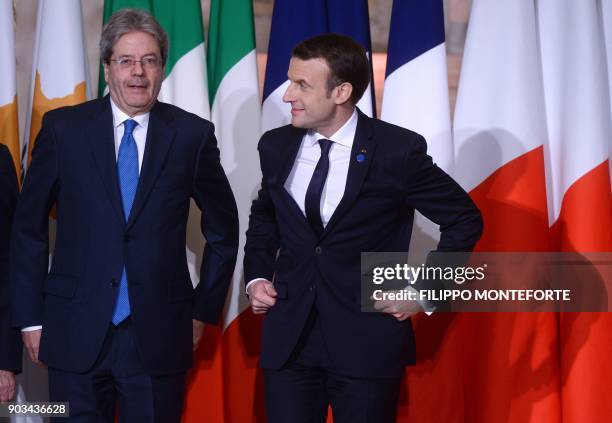 France's President Emmanuel Macron prepares to pose next to Italy's Prime Minister Paolo Gentiloni for a family photo for the Summit of Mediterranean...