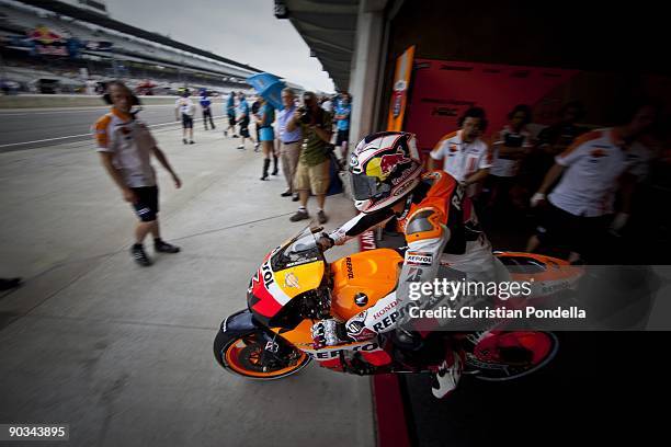 Repsol Honda Team rider Dani Pedrosa of Spain leaving the pits for his final practice on qualifying day at the Moto GP race at the Red Bull...