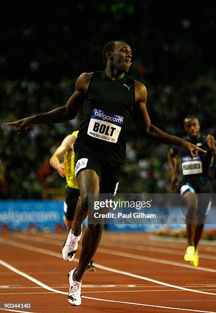 Usain Bolt of Jamaica celebrates as he crosses the finish line to take the victory in the Mens 200m during the IAAF Golden League Memorial Van Damme...