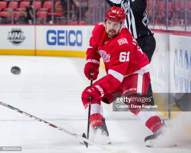 Xavier Ouellet of the Detroit Red Wings shoots the puck against the Tampa Bay Lightning during an NHL game at Little Caesars Arena on January 7, 2017...