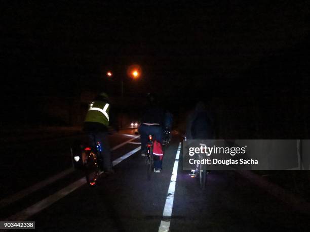 night time bicycles on the roadway - reflector fotografías e imágenes de stock