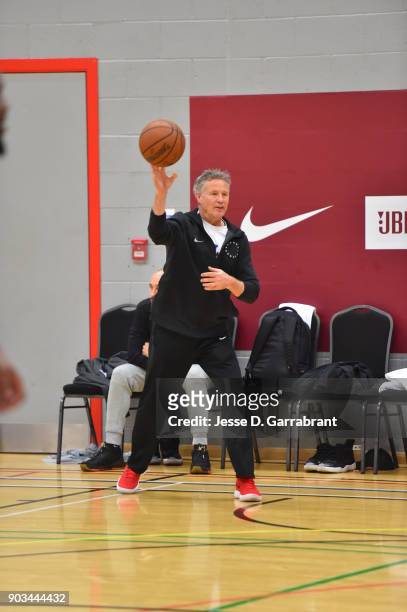 Head Coach Brett Brown of the Philadelphia 76ers passes during practice as part of the 2018 NBA London Global Game at Citysport on January 10, 2018...
