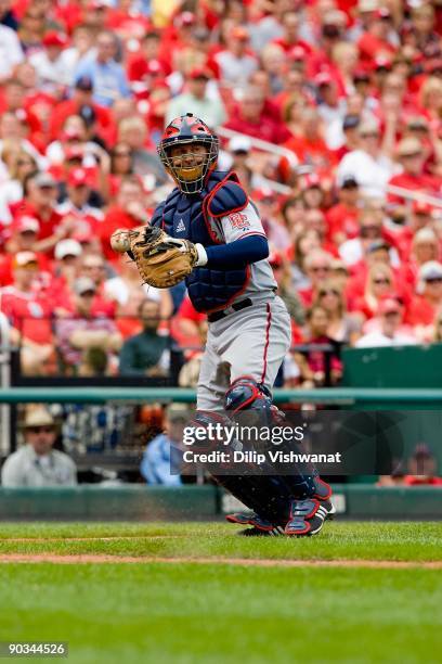 Josh Bard of the Washington Nationals throws to first base against the St. Louis Cardinals on August 30, 2009 at Busch Stadium in St. Louis,...